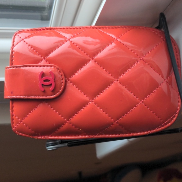 CHANEL Handbags - CHANEL Coral Quilted Patent Leather Phone Holder Case- Preloved